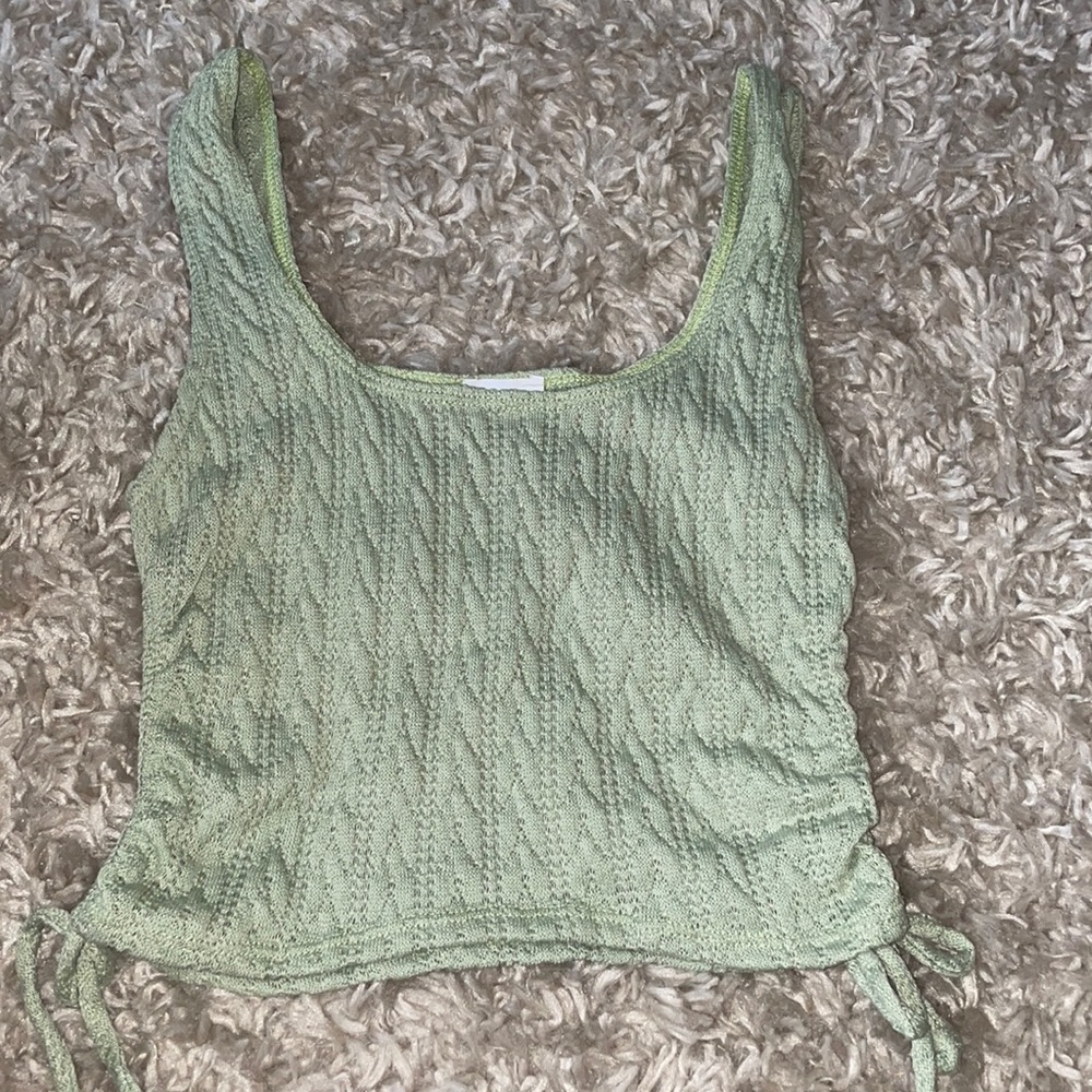 Light green crop top! With ties on the side. Purchased through Lash Next Door.